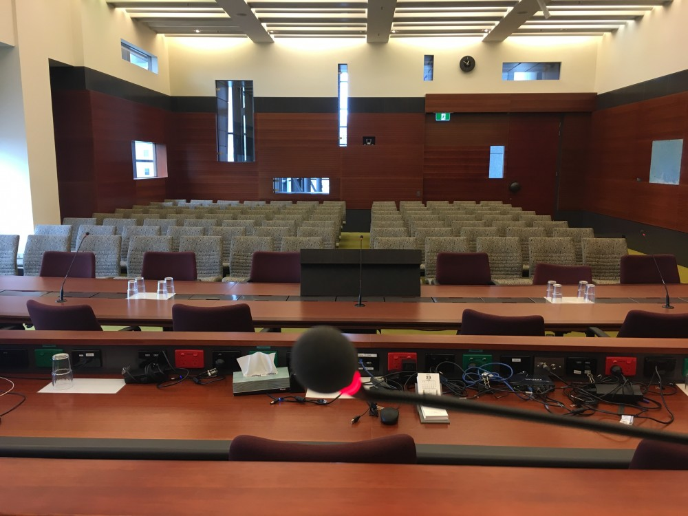 I am sitting in a courtroom